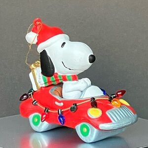 Santa Snoopy Delivering Presents in a Convertible, United Feature Syndicate